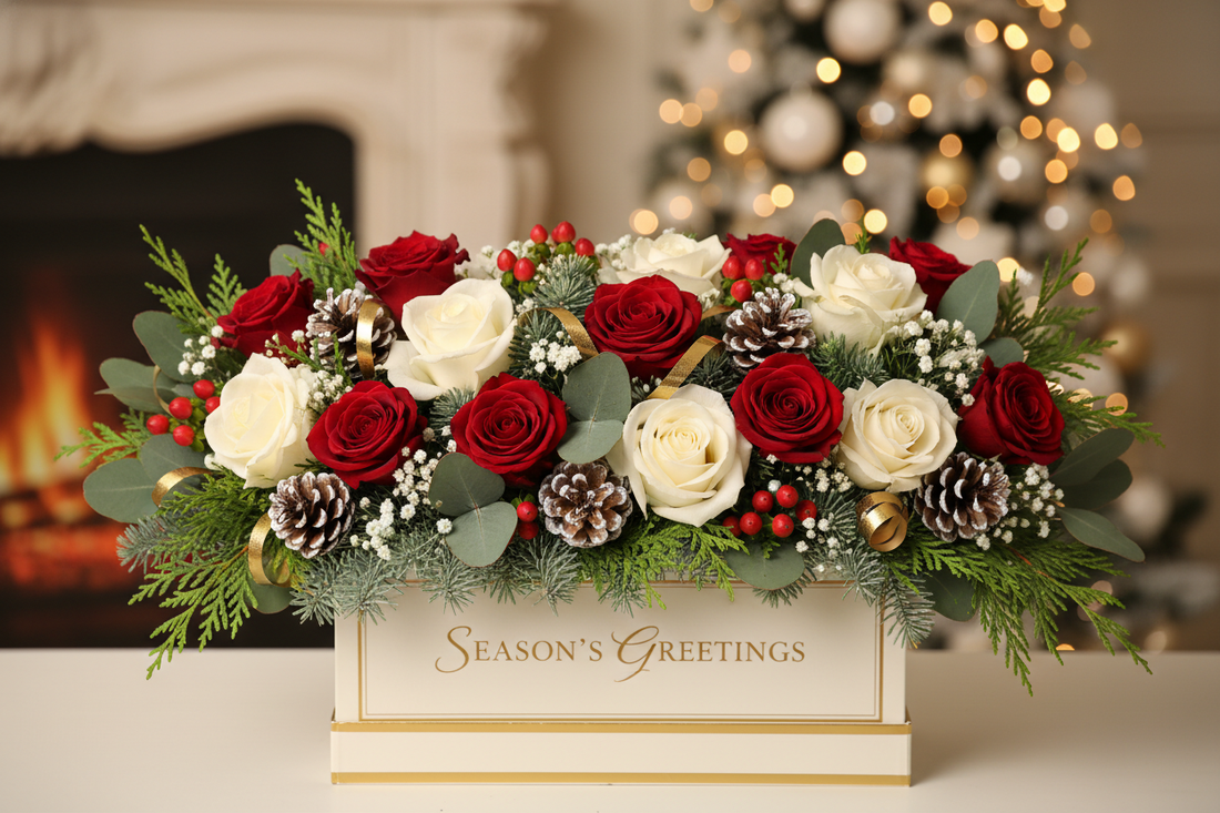 Christmas flower arrangement with red and white roses, winter greenery, and festive holiday accents from Flowers Valley