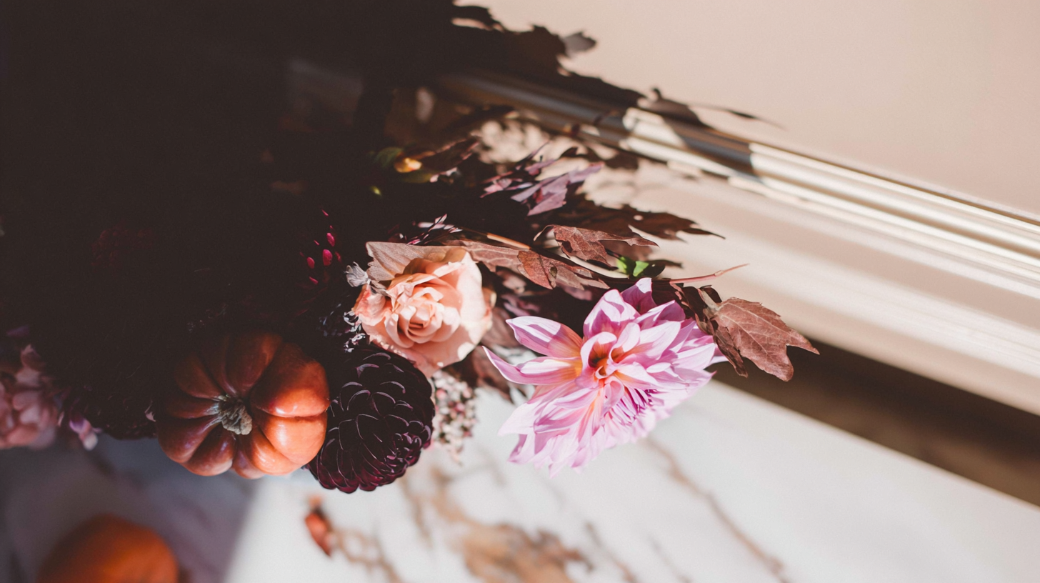 Luxury floral arrangement with autumn chrysanthemums and imported peonies styled in soft natural light — perfect for November birthdays.