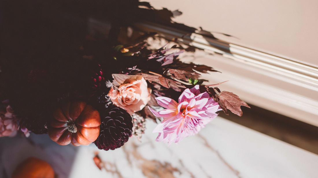 Luxury floral arrangement with autumn chrysanthemums and imported peonies styled in soft natural light — perfect for November birthdays.