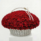 300 red roses arranged in a luxury white wicker basket by Flowers Valley