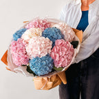 Hydrangea Mix Bouquet with pink, blue, and white blooms wrapped in kraft paper