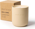 Beige scented candle with 'Craft & Kin' branding next to a cardboard box - Neroli and Jasmine scent