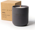 Dark gray candle with 'Craft & Kin' branding next to a brown box packaging - Santal scent