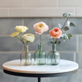 Alt text:
Stylish table bud vases set of three with pastel roses and greenery on a round table – Flowers Valley