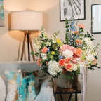 Spring floral basket styled on a side table with natural light