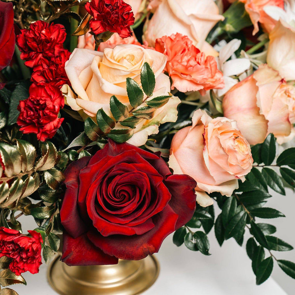 Close-up of red and peach roses from Opulent Romance bouquet