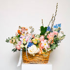 Easter Eve spring flower basket with roses, delphinium, and pastel blooms