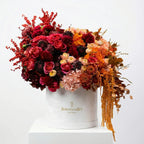 Luxury autumn flower box with claret red and amber blooms in a signature Flowers Valley box