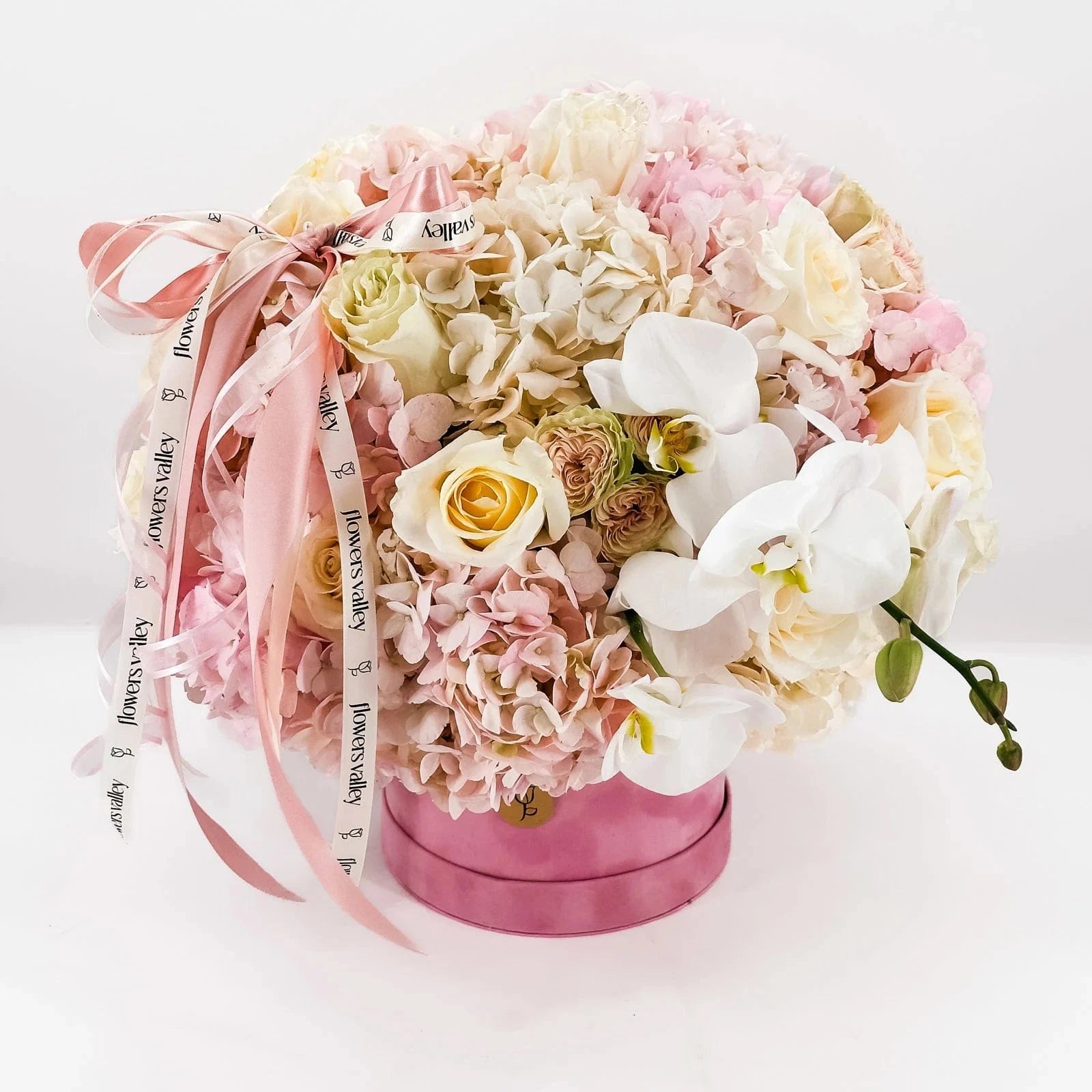 Top view of Baby Girl Bloom Box showing lush blooms and signature Flowers Valley ribbons
