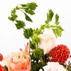 Close-up of Cinnamon Bloom Arrangement highlighting orange dahlias and blush roses
