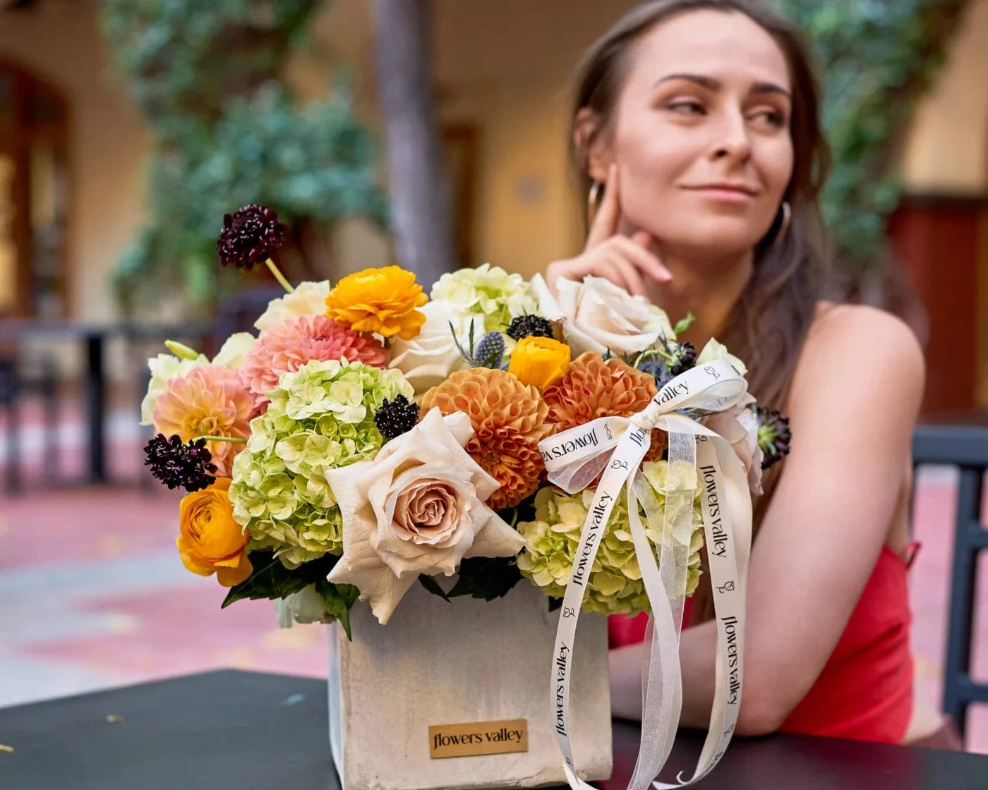 Smiling woman with luxury flower bouquet arrangement from Flowers Valley – same-day flower delivery in San Ramon, CA