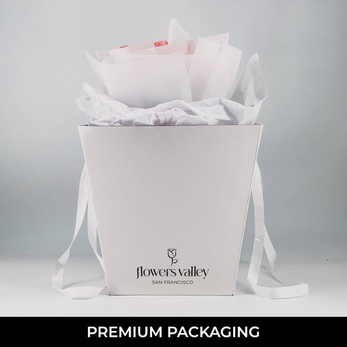 Flowers Valley’s signature white gift bag with tulip bouquet inside—ready for next-day delivery or local pickup.