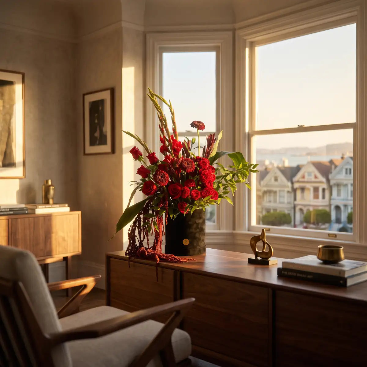 Gladiolus Noir red flower box styled on a walnut sideboard by a San Francisco bay window — luxury flower delivery by Flowers Valley