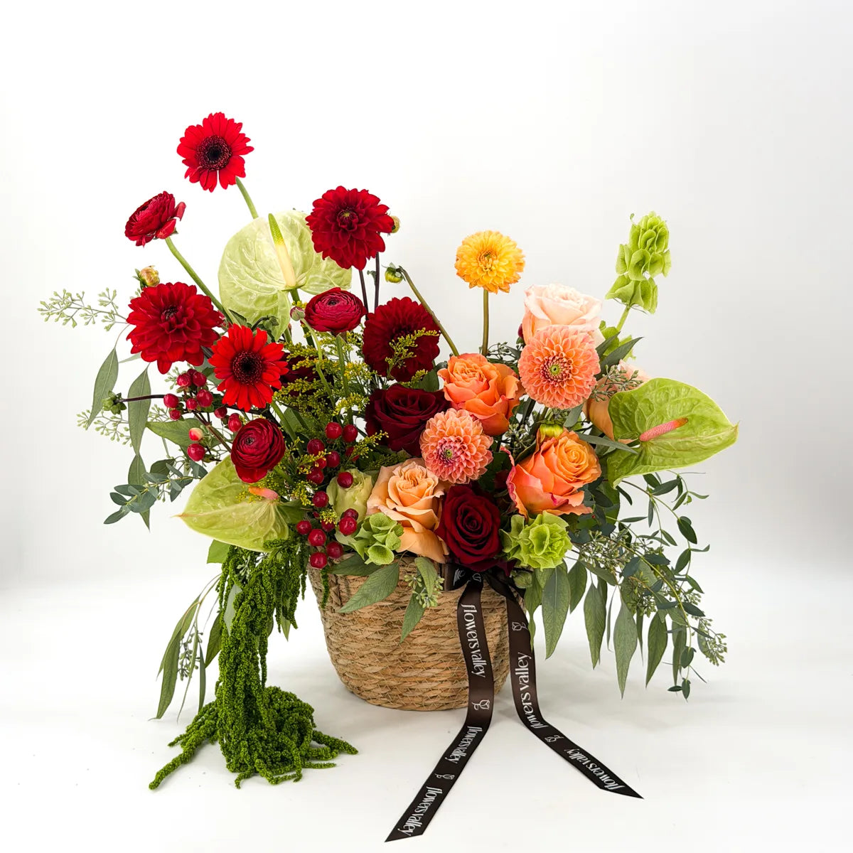 Autumn flower basket with burgundy dahlias, peach roses, gerberas, and bells of Ireland, tied with the Flowers Valley ribbon — same-day Bay Area delivery