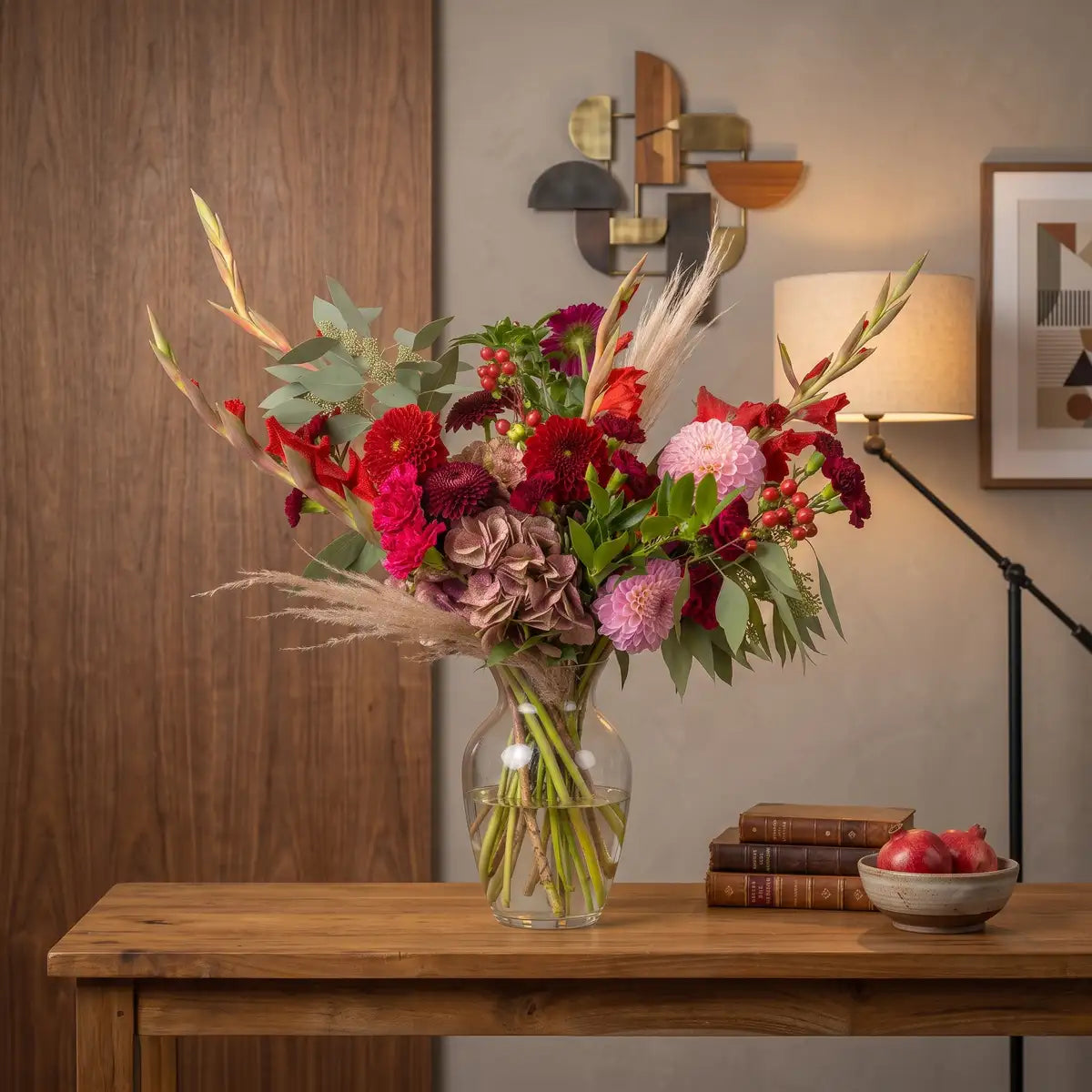 Harvest Petite autumn bouquet styled in a glass vase on a wooden console — fall flower delivery by Flowers Valley