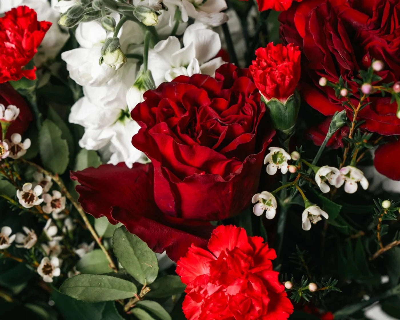 Romantic bouquet of red roses, carnations, and white blooms for Hayward flower delivery – Flowers Valley