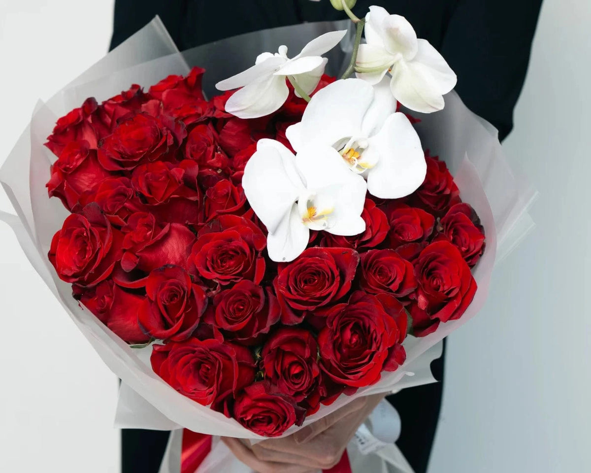 Luxurious heart-shaped bouquet of red roses with white orchids – Flowers Valley Saratoga flower delivery