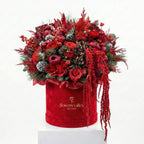 Luxury holiday flower box with deep red blooms and seasonal greenery in a velvet box by Flowers Valley