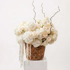 Ivory Sculpted Grace white roses and hydrangea arrangement in woven basket