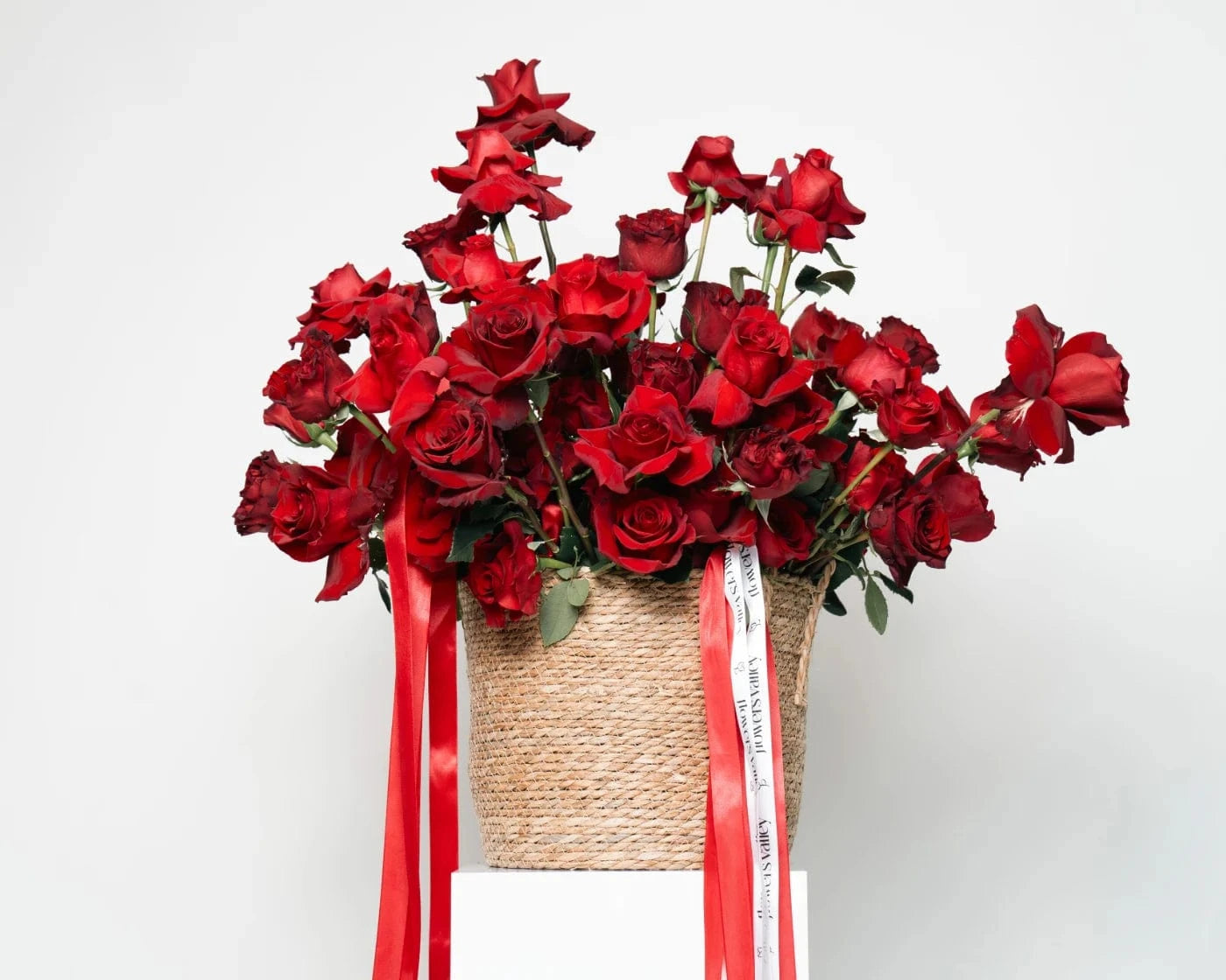 Luxury basket of vibrant red roses with lush greenery and ribbon accents – Flowers Valley Rio Vista flower delivery