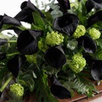 Close-up of calla lilies and hydrangea on casket arrangement