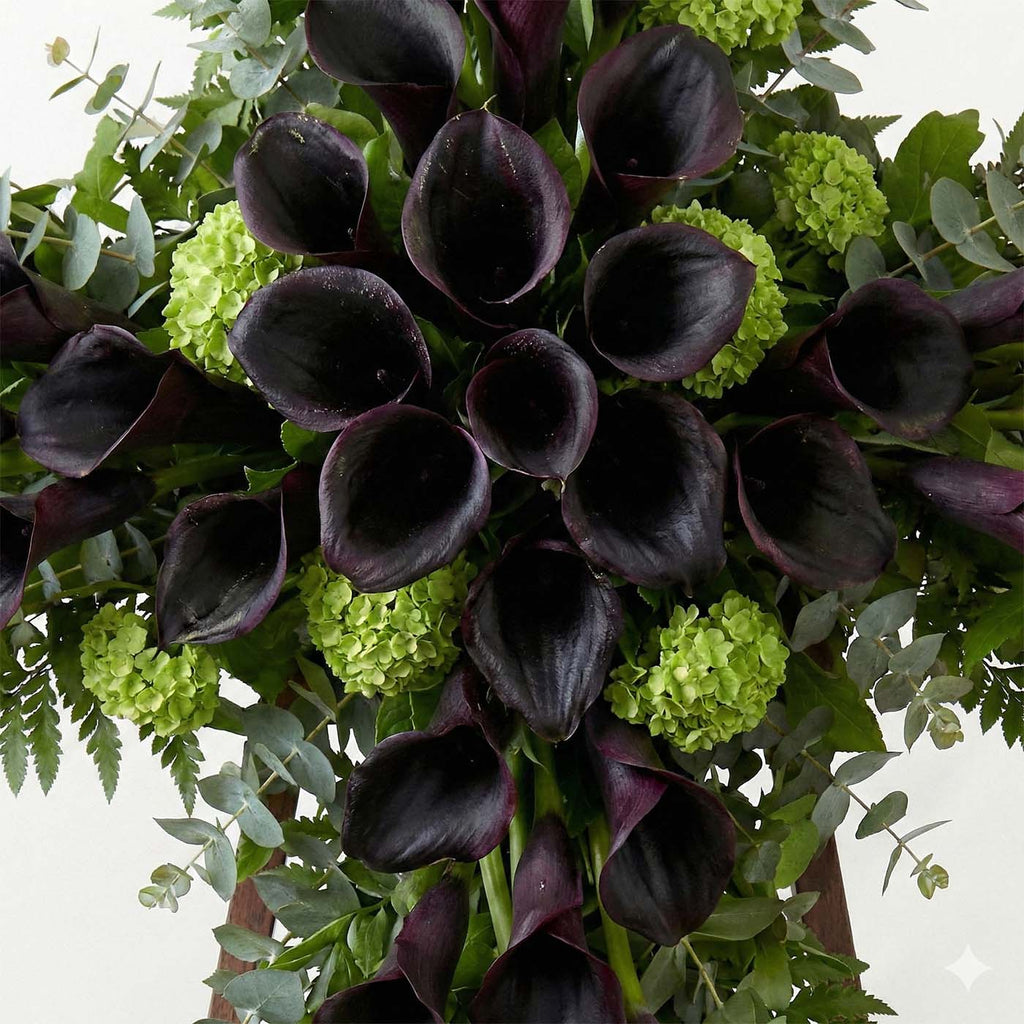 Close-up of calla lilies forming a floral cross