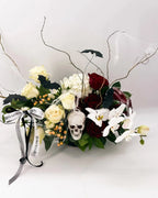 Side angle of Midnight Spell Arrangement with twisted branches, cobwebs, and Halloween accents