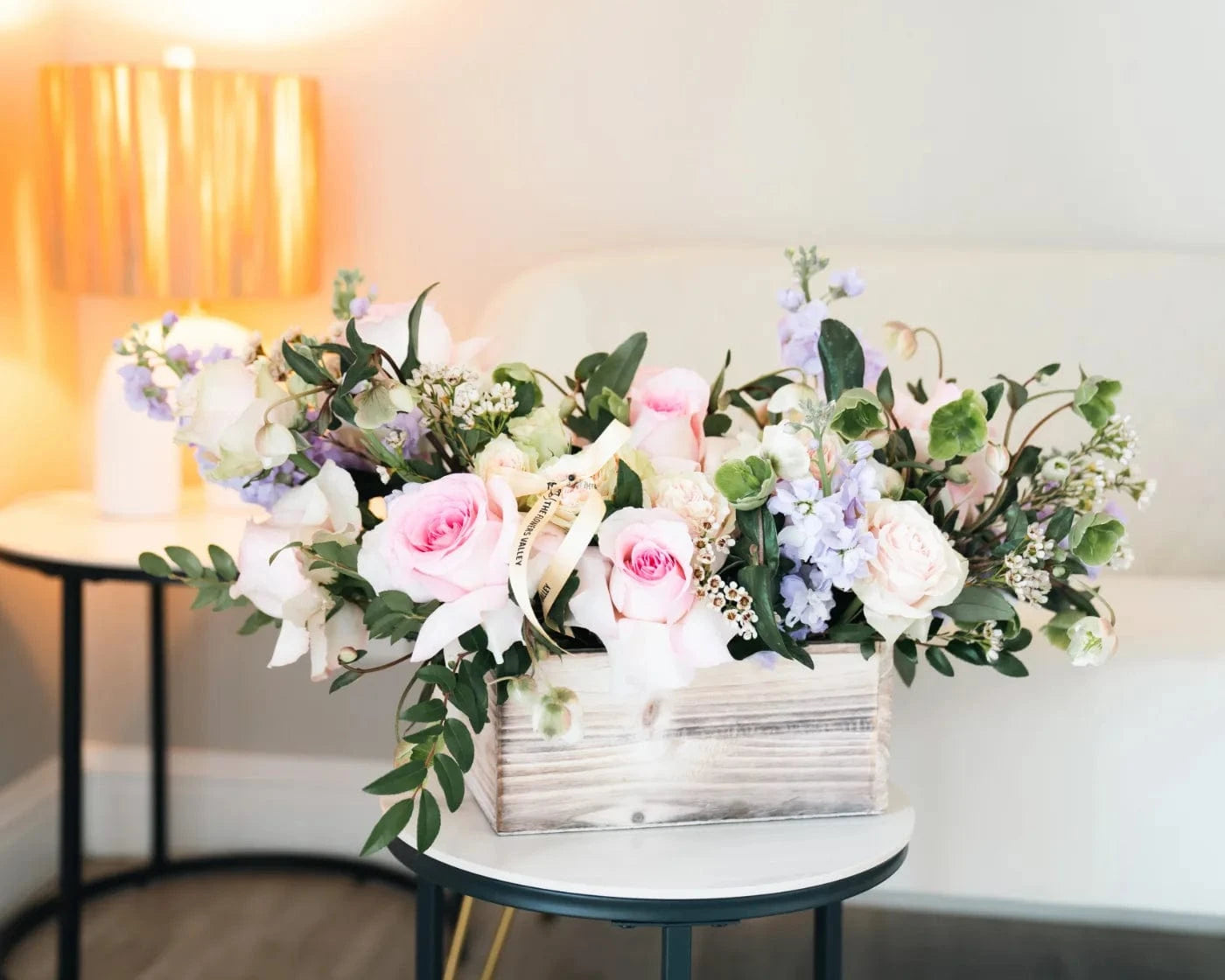 Charming pastel arrangement with pink roses, white blooms, and purple accents in a decorative box – Flowers Valley Sunnyvale flower delivery
