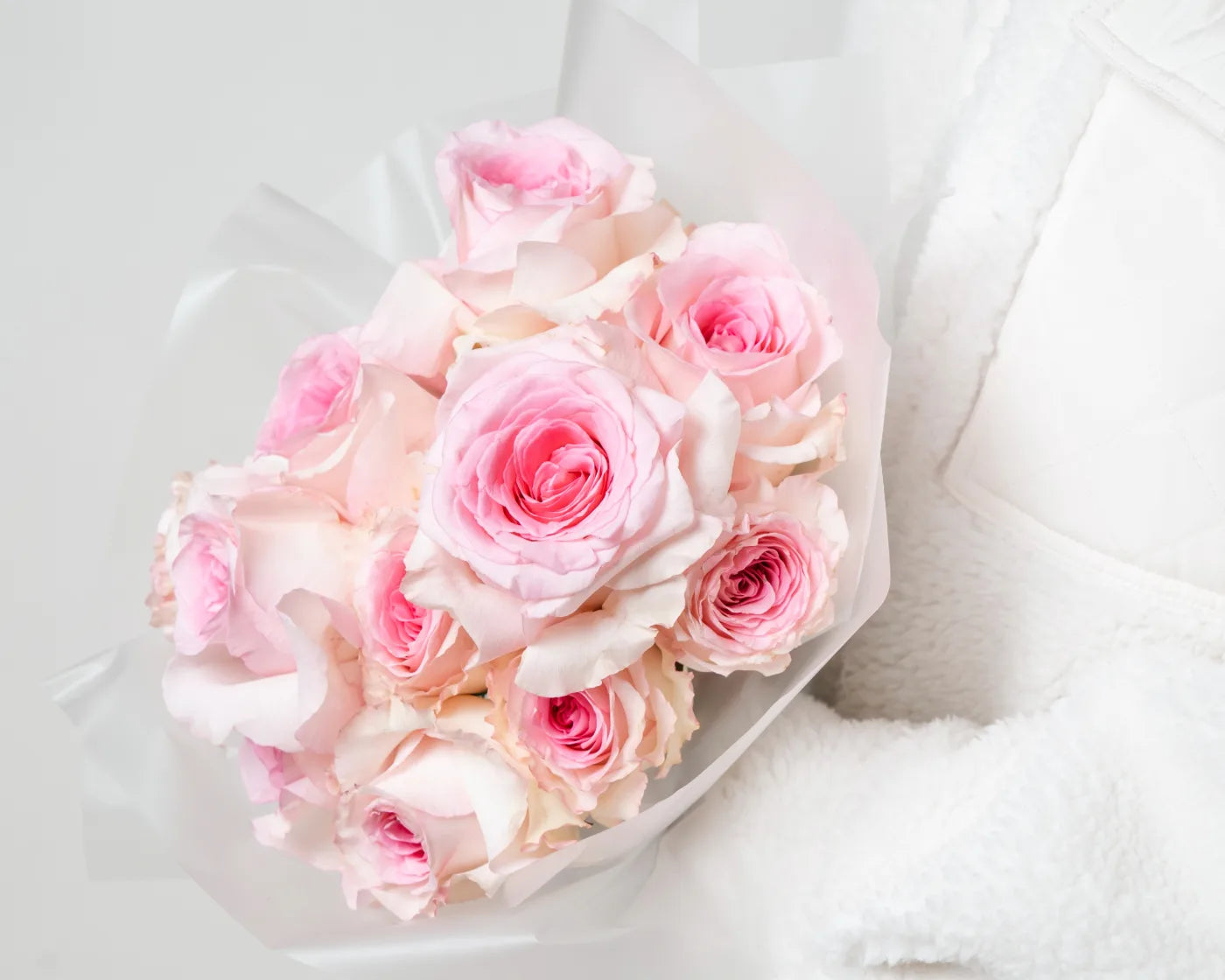 Delicate bouquet of pastel pink roses wrapped in soft paper – Flowers Valley Pleasant Hill flower delivery