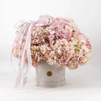 Pink Elegance Hydrangea Box with lush pink hydrangeas in velvet hatbox and ribbon accent
