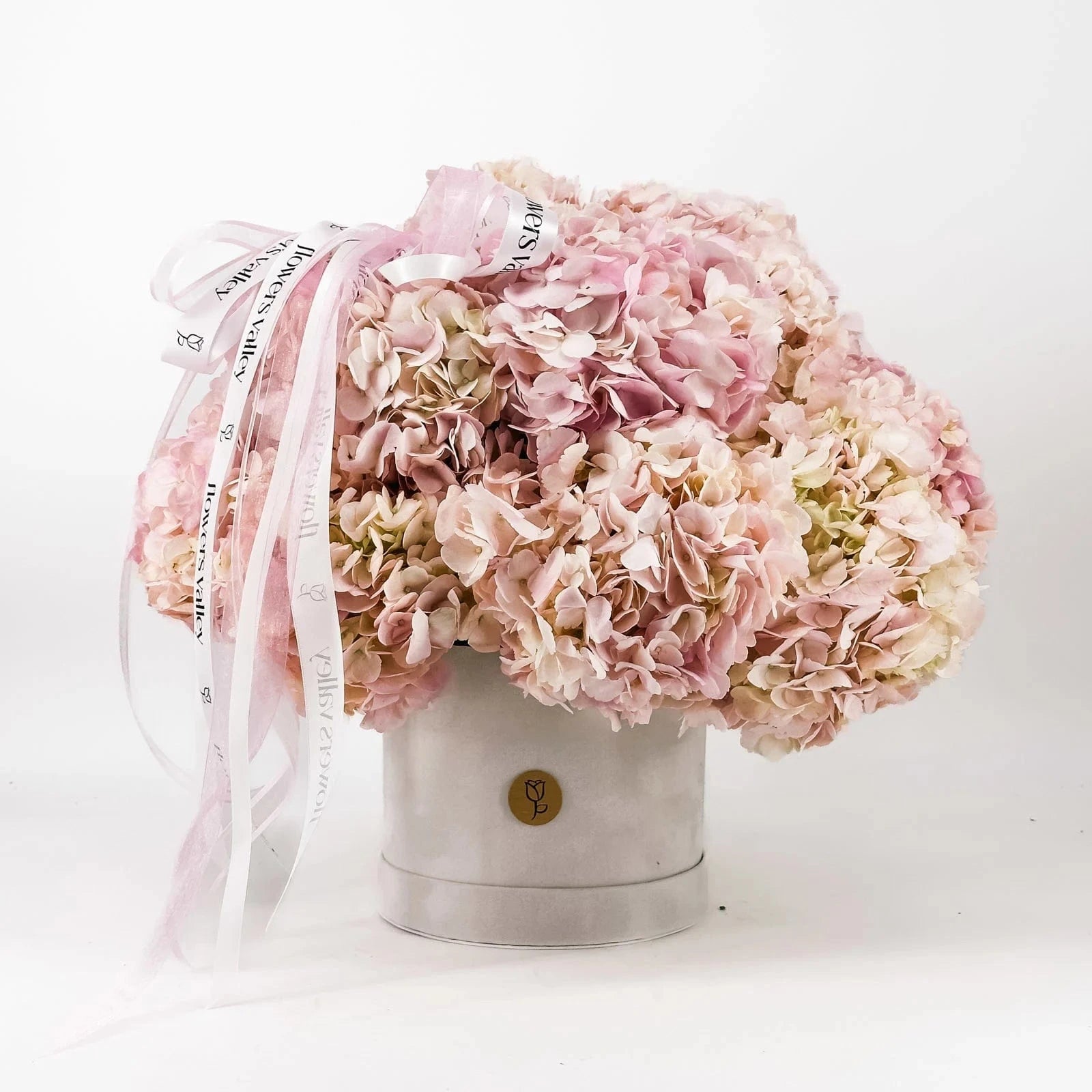 Pink Elegance Hydrangea Box with lush pink hydrangeas in velvet hatbox and ribbon accent