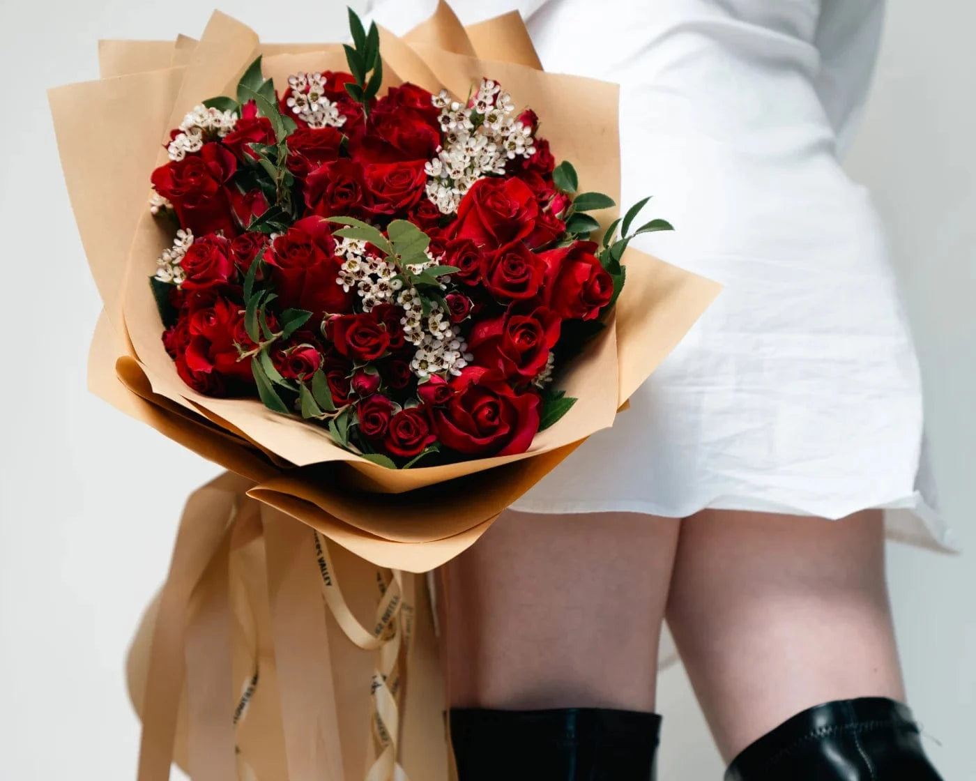 Stunning bouquet of fresh red roses with white accent flowers wrapped in kraft paper – Flowers Valley Guerneville flower delivery
