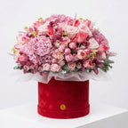Luxury pink flower hatbox arrangement with roses, tulips, orchids, and hydrangea by Flowers Valley