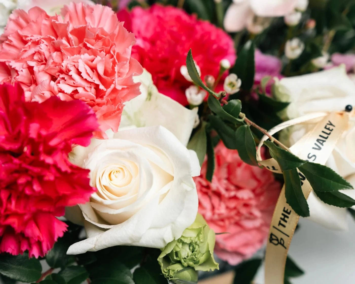 Elegant bouquet of roses, carnations, and seasonal flowers in a Tiburon home – Flowers Valley delivery