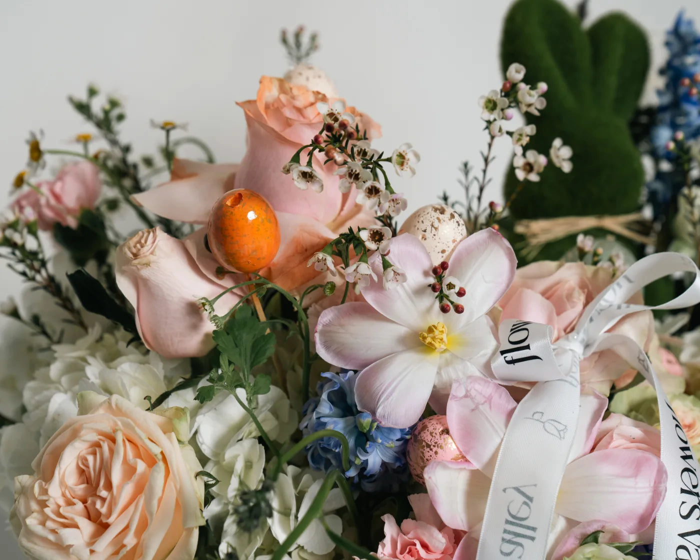 Spring bouquet with pastel roses, orchids, and Easter accents for Union City flower delivery – Flowers Valley