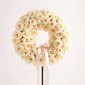 white roses funeral wreath