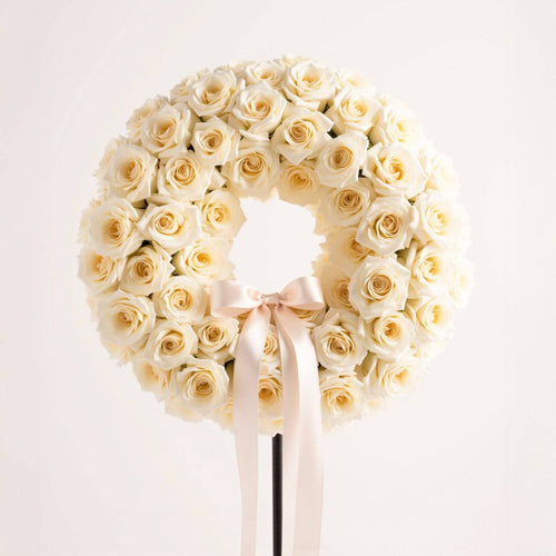 white roses funeral wreath